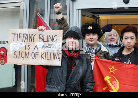 Manchester, UK 6th February 2016 Pro Palestinian campaigners.  One demonstrator is holding a Communist Party Flag whilst another holds a placard which reads 'Tiffany Bling is a sign of killing' Credit:  Barbara Cook/Alamy Live News Stock Photo