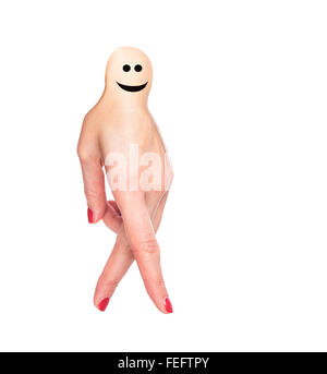 Female hand in a funny little man. Stock Photo