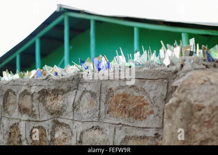 Stone and concrete wall topped with broken glasses for security of a local house. Kombolcha town-Debub Wollo zone-Ethiopia. Stock Photo