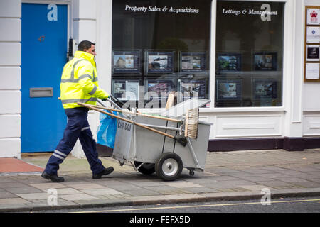 Street cleaner walking on a pavement in London, UK Stock Photo