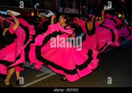 Madrid, Spain 6th February 2016. A group of female dancers from Ecuador wearing pink costumes. The carnival parade in Madrid, Gran Pasacalles del Carnaval (The Grand Carnival Parade), was held in the district of Tetuán Madrid, Spain.  Credit:  Lawrence JC Baron/Alamy Live News. Stock Photo