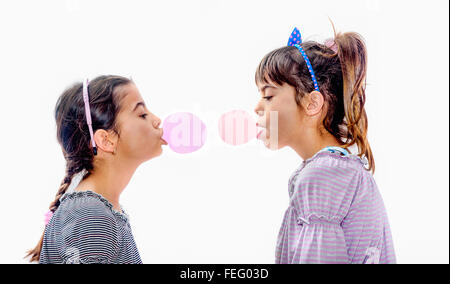 Portraits of beautiful little girls blowing bubbles Stock Photo
