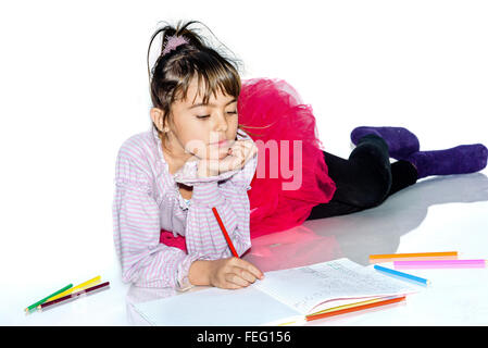 Dreamy little girl with pencils Stock Photo