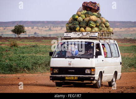 Niamey, Niger.  Taxi-van Carrying Melons, Pumpkins, and People to Market. Stock Photo