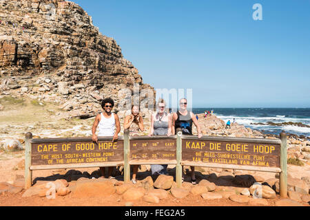Young tourists by Cape of Good Hope sign, Cape Peninsula, City of Cape Town, Western Cape Province, Republic of South Africa Stock Photo
