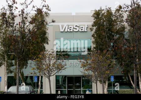 A logo sign outside of the headquarters of ViaSat Inc., in Carlsbad, California on January 30, 2016. Stock Photo