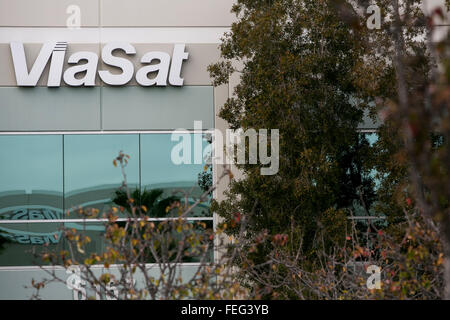 A logo sign outside of the headquarters of ViaSat Inc., in Carlsbad, California on January 30, 2016. Stock Photo