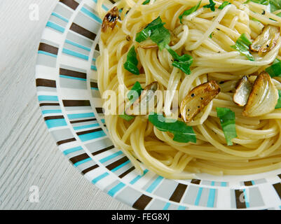 Spaghetti aglio e olio -  spaghetti with garlic and oil.traditional Italian pasta dish, coming from Napoli Stock Photo