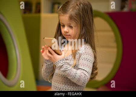 Little girl with mobile phone Stock Photo