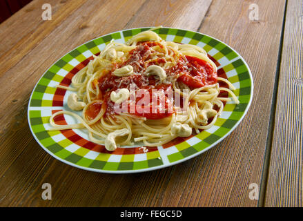 Spaghetti alla corsara - Italian pasta with tomato sauce and cashew nuts Stock Photo