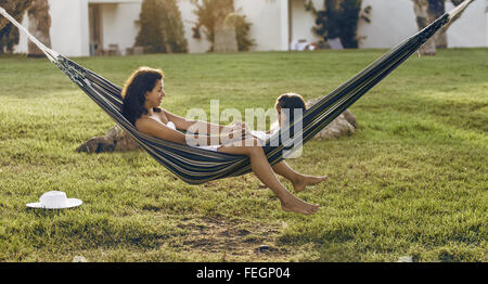 Mother and daughter are resting in the country side. Retro style. Stock Photo