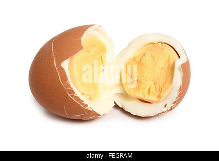 Broken brown hard boiled eggs with shell. Isolated with clipping path. Macro. Stock Photo