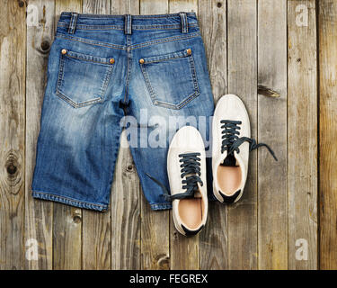 Set of travel items including jeans and sneakers. Planning of  overhead of essentials for vacation and travelling on holiday. Di Stock Photo
