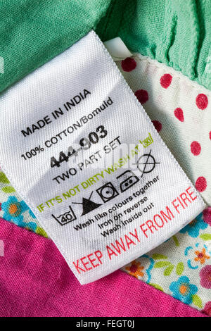 Keep away from fire label in 100% cotton garment made in India with care instructions - sold in the UK United Kingdom, Great Britain Stock Photo