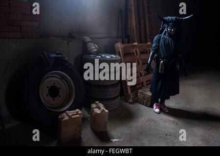 A young man with his devil costume is preparing to participate in the carnival of Luzon (Guadalajara) Stock Photo