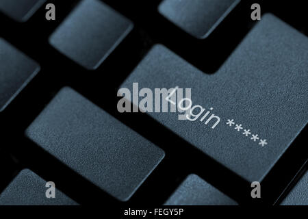 Horizontal close up of black keys on a keyboard with the word login on one of them Stock Photo
