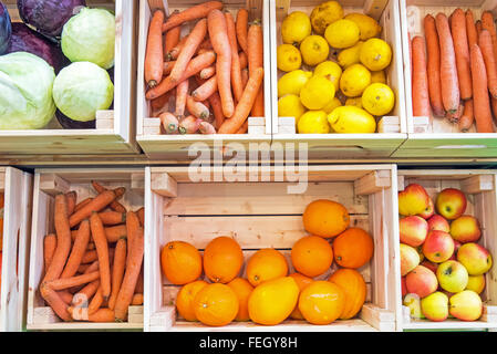 Fruits and vegetables in wooden boxes for sale at a market Stock Photo ...