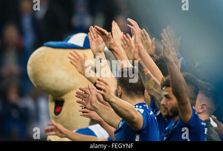 Gelsenkirchen, Germany. 06th Feb, 2016. Schalke's players cheer after the German Bundesliga soccer match between FC Schalke 04 and VfL Wolfsburg at the Veltins Arena in Gelsenkirchen, Germany, 06 February 2016. Photo: BERND THISSEN/dpa/Alamy Live News Stock Photo