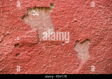 Detail of a red plaster partially peeling off Stock Photo