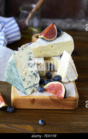 gourmet cheese mix on board, food closeup Stock Photo