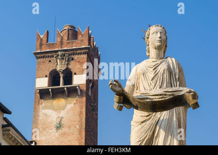 The ancient roman statue called Madonna Verona on a fountain in Piazza delle Erbe in Verona, Stock Photo