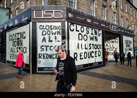 USC clothing store on Princes Street, Edinburgh, with closing down signs on the windows. Stock Photo