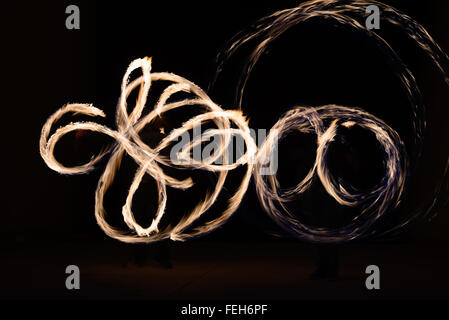 Fire poin in action by a male performance in Thai restaurant Stock Photo