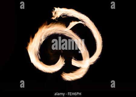 Fire poin in action by a male performance in Thai restaurant Stock Photo