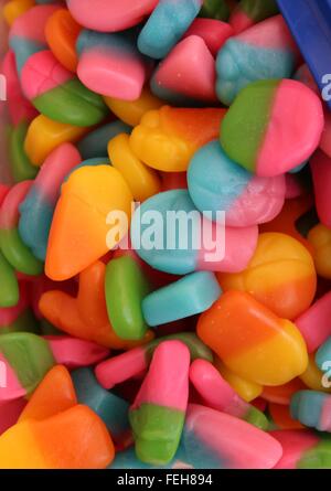this is a close up of brightly colored gummy sweets from a pic n mix Stock Photo