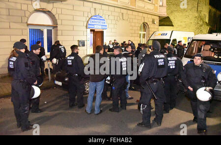 Gelsenkirchen, Germany. 06th Feb, 2016. Members of the German police stand in front of the club house of the Schalke fan group 'Hugos' located near the railway station in Gelsenkirchen, Germany, 06 February 2016. Supporters of German Bundesliga soccer club FC Schalke 04 injured 23 police officers in a violent riot and ran through the 'Hugos' club house afterward. Photo: KDF-TV & Picture/dpa/Alamy Live News Stock Photo