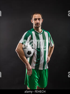 Football-player with a ball Stock Photo