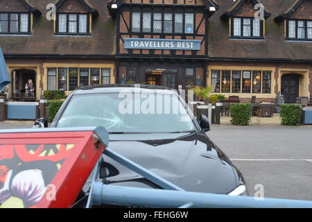 Reading, Berkshire, UK. 07th Feb, 2016. 2014 Plate BMW gets smashed by the Travellers Rest sign outside the premises believed to be caused by the high speed wind, on the Henley road in Reading. Management would not comment on the subject. Credit:  Charles Dye/Alamy Live News Stock Photo
