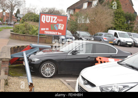 Reading, Berkshire, UK. 07th Feb, 2016. 2014 Plate BMW gets smashed by the Travellers Rest sign outside the premises believed to be caused by the high speed wind, on the Henley road in Reading. Management would not comment on the subject. Credit:  Charles Dye/Alamy Live News Stock Photo