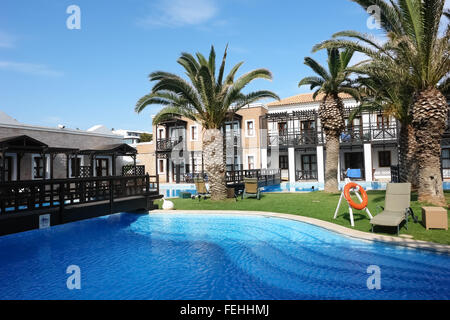 Big blue swimming-pool, tower and terrain in high class greek hotel Aldemar Royal Mare, Crete island. Stock Photo
