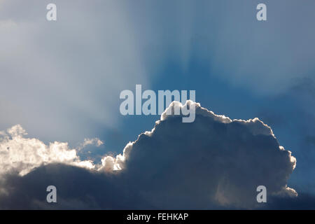 sun behind a cloud Stock Photo