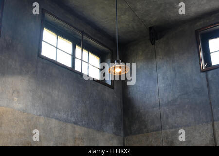 A solitary light in the Crematorium at the Terezin concentration camp in the Czech Republic. Stock Photo