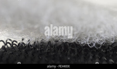 Hook-and-loop fastener aka Velcro in closeup, isolated on black Stock Photo