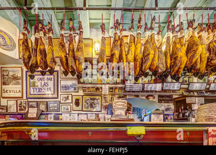 Las Teresas Tapas Bar Restaurant in Sevilla Seville Spain. Iberico ham Jamon de Bellota from acorn fed pigs hanging from ceiling Stock Photo