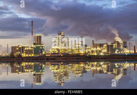 Oil refining factory in the industrial area of Antwerp during dusk, Flanders, Belgium Stock Photo