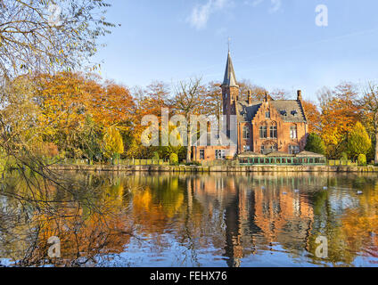 Flemish style building reflecting in Minnewater lake, Bruges, Belgium Stock Photo