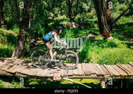 GOMEL, BELARUS - JUNE 7, 2015: Mountain Bike cyclist riding track at sunny day, healthy lifestyle active athlete doing sport Stock Photo