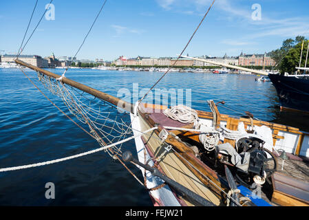 View from Djurgarden island at the Vasa museum over a historic sailing ship and the Stockholm harbour to Strandvägen, Sweden Stock Photo