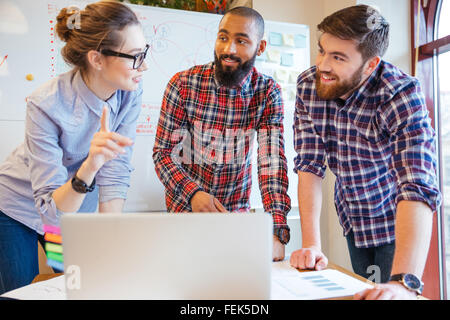 Multiethnic group of young business people working in office Stock Photo