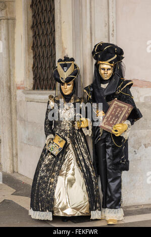 People in costume for Venice Carnival week 2016 in Saint Mark's square Stock Photo