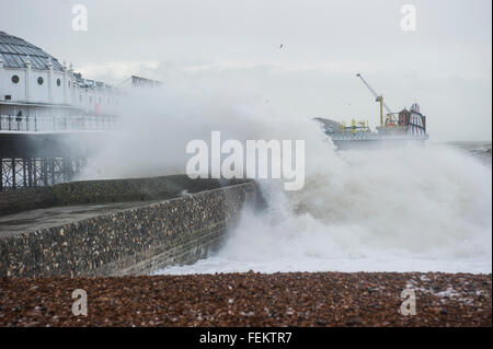 Brighton, UK. 8th February, 2016. UK Weather: Huge crashing waves battering Brighton Pier as a result of strong winds caused by Storm Imogen. The Met office has issued amber and yellow weather warnings along the south coast for strong winds and gusts of up to 70 mph. Credit:  Francesca Moore/Alamy Live News Stock Photo