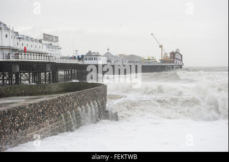 Brighton, UK. 8th February, 2016. UK Weather: Huge crashing waves battering Brighton Pier as a result of strong winds caused by Storm Imogen. The Met office has issued amber and yellow weather warnings along the south coast for strong winds and gusts of up to 70 mph. Credit:  Francesca Moore/Alamy Live News Stock Photo