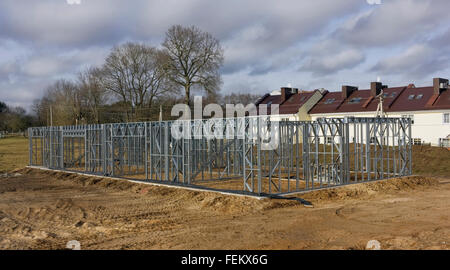 Near the village the car service is under construction of metal mass production trellised galvanized designs. Panoramic landscap Stock Photo