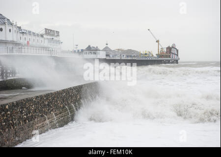 Brighton, UK. 8th February, 2016. UK Weather: Huge crashing waves battering Brighton Pier as a result of strong winds caused by Storm Imogen. The Met office has issued amber and yellow weather warnings along the south coast for strong winds and gusts of up to 70 mph. Credit:  Francesca Moore/Alamy Live News Stock Photo