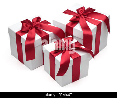 Gift boxes with red ribbons and bows isolated on the white background, clipping path included. Stock Photo