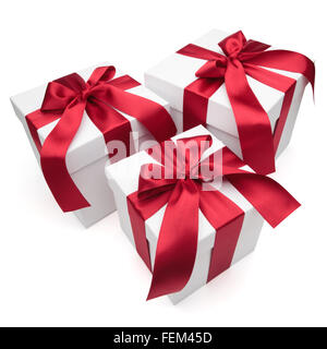 Gift boxes with red ribbons and bows isolated on the white background, clipping path included. Stock Photo